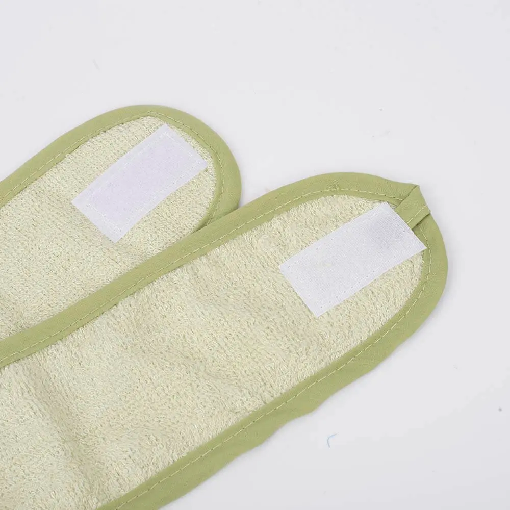 Close-up of green bamboo adjustable face wash headband DC-HDB001 showing velcro strap detail.